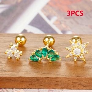 Detailed macro view of 3pcs gold stainless steel stud earrings set with green zircons