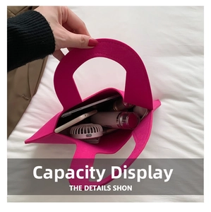 Interior view of rose red felt handbag showing large capacity for phone and cosmetics