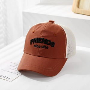 Close-up of kids mesh baseball cap with FRIENDS embroidery on breathable mesh fabric