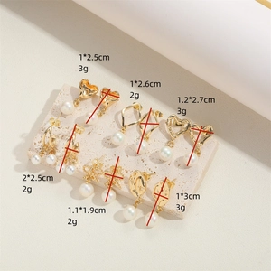 Assorted gold heart and geometric pearl earrings with precise size and weight specs