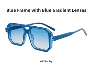 Detail view of transparent blue double-bridge sunglasses with gradient lenses at a 45-degree angle