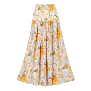Detail of bohemian long skirt featuring ocean starfish prints and tiered elastic high waist