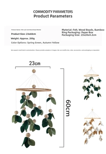 Detailed view of handmade felt leaf and wood bead crib mobile with size specifications