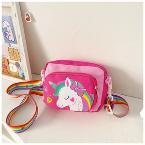 Detail of pink unicorn kids crossbody bag featuring rainbow straps and cartoon pattern