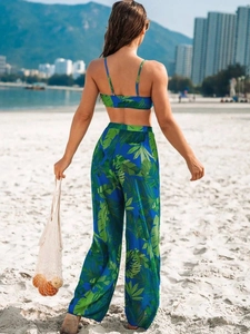 Rear view of tropical palm print beach set with cropped top and wide leg pants