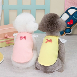 Charming pet lace vests in pink and yellow with red checkered bows for cats and dogs