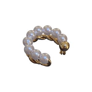 Double-layered gold-plated C-shaped ear cuff featuring elegant white pearls on white background