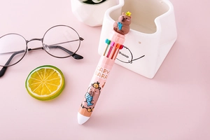 Detail of pink ten-color Capybara ballpoint pen with 3D silicone doll on top
