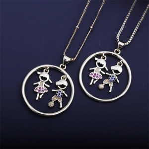Detailed shot of gold necklaces with boy and girl heart pendants inlaid with colored zircons