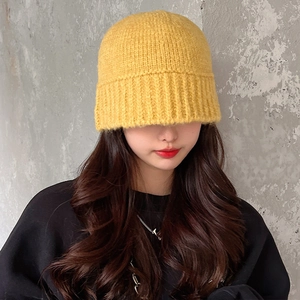 Stylish bright yellow chunky knit beanie for women in warm wool-like texture
