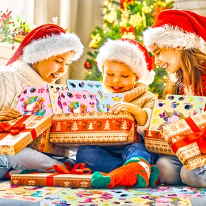 Close-up of kids excitedly unboxing colorful unicorn DIY stickers in a festive setting