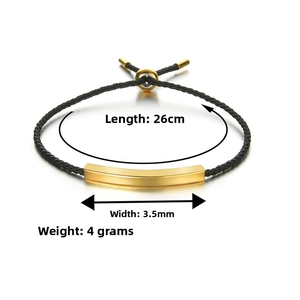 Detail of black braided bracelet with 26cm length and 3.5mm gold metal bar specs