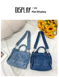Flat lay of light and dark blue denim tote bags with ruffled edges and adjustable straps