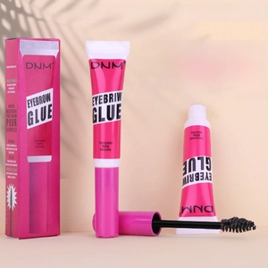 Macro view of eyebrow styling gel wand with spiral brush for long-lasting hold