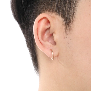 Minimalist 18K rose gold stainless steel hoop earring shown on a model for daily wear