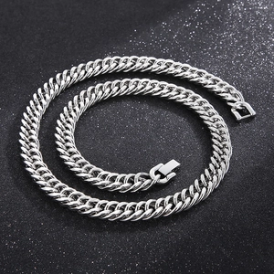 Detailed view of silver stainless steel cuban curb chain with secure jewelry clasp