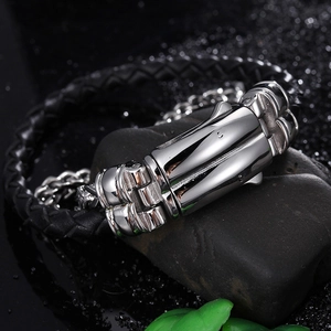 Macro shot of the spring clasp on a black braided leather bracelet for men