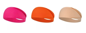 Detalle de cintas elásticas fruncidas en colores rojo rosa, naranja y rosa oscuro