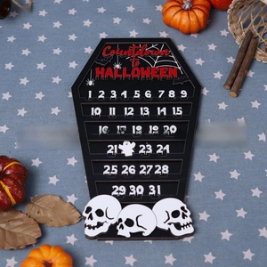 Macro detail of wooden coffin-shaped Halloween countdown calendar with skulls on star cloth