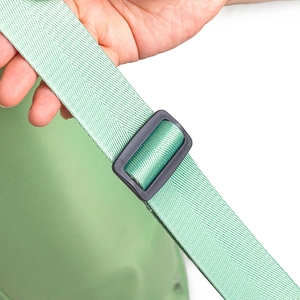 Close-up of green nylon strap and black plastic adjustment buckle on yoga bag