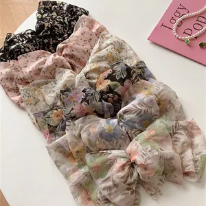 Lot de six barrettes à nœuds en mousseline florale avec clips à ressort variés