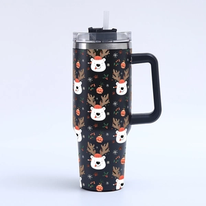 Detail of 40oz stainless steel tumbler with handle and festive Christmas reindeer patterns
