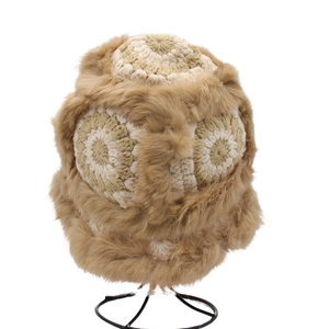 Detail of crochet winter monster hat with thick beige wool and brown faux fur lining