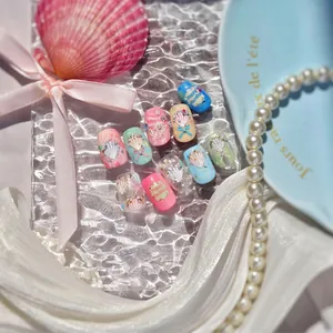Artistic summer beach style nail stickers with 3D embossed shells and pearls on blue plate