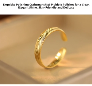 Macro shot of polished gold adjustable ring with unique spiral wave texture detail