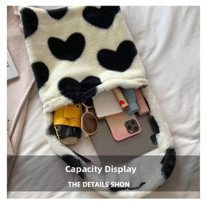 Interior view of plush heart tote bag showing large capacity for tablet and cosmetics