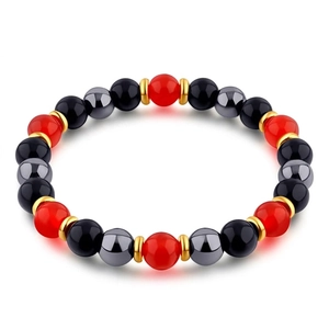 Detailed macro view of beaded bracelet with red, black, and silver tiger eye stones