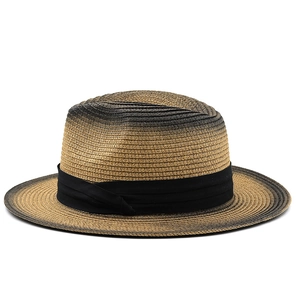 Detail view of woven straw sun hat with gradient brown finish and black ribbon band