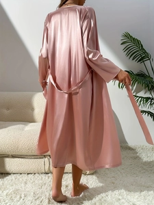 Detailed back view of a dusty rose satin long-sleeved robe with silky waist tie belt