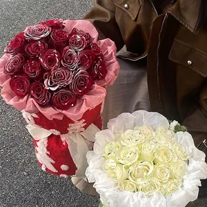 Elegant Christmas rose bouquets in red and cream white with snowy finish and gift wrapping