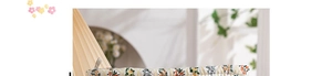 Detailed close-up of quilted floral fabric with intricate orange flower patterns and soft texture
