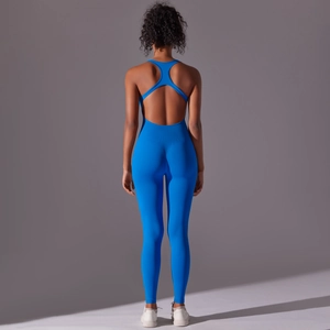 Rear view of cobalt blue backless yoga jumpsuit showing seamless knit texture and fit