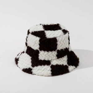 Close-up of the plush black and white checkerboard texture on this faux fur bucket hat