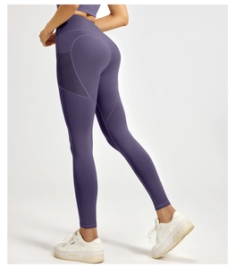 Detail view of the high-waisted deep purple yoga leggings with side pockets and lifting seams