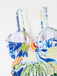 Detail of adjustable shoulder strap with silver buckle on floral print tankini swimsuit