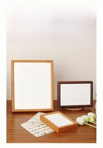 Detailed view of walnut and oak wood frames in various sizes for wall and desk display
