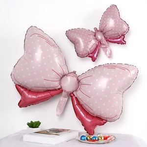 Pink polka dot bow foil balloon set for birthday party decoration on a white background
