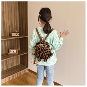 Detailed back view of a plush leopard print mini backpack with adjustable straps for kids