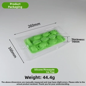 Detailed view of green silicone ice cube tray in fruit shapes including pineapples