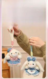 Detail of cute white plush rabbit pendants with lace dresses and sturdy braided lanyards