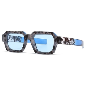 Modern narrow rectangular sunglasses with marble tortoise frame and light blue lenses