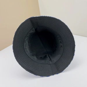 Reversible houndstooth bucket hat with black inner lining and reinforced stitched brim