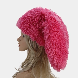 Pink plush trapper hat with long rabbit ears for women featuring fluffy faux fur material