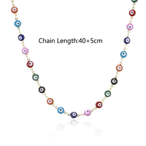 Detailed view of gold plated chain necklace with colorful evil eye charms and length specs