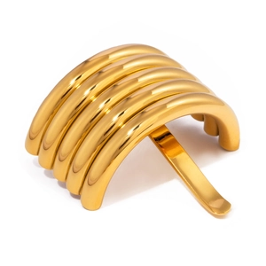 Polished gold U-shaped hair fork with a multi-layered curved metal design for sleek updos