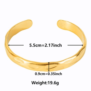 Detail shot showing 5.5cm diameter and textured 18k gold plated stainless steel cuff